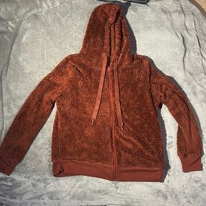 Very warm fluffy sweater. Size is medium.